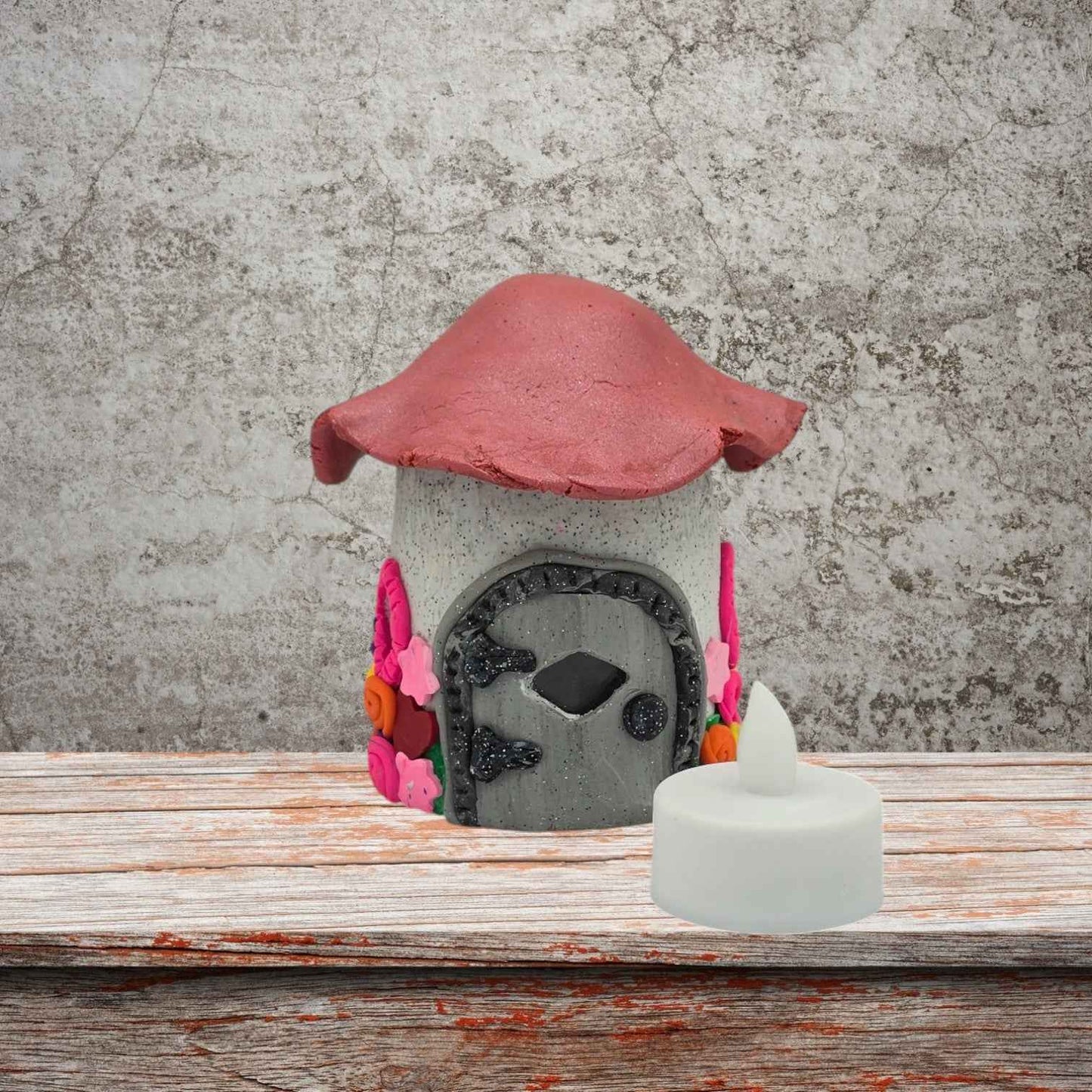 a cottage design fairy house night light with pink roof front view