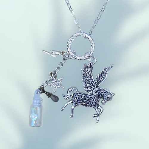 A LONG CHAIN NECKLACE WITH A FLYING HORSE CHARM