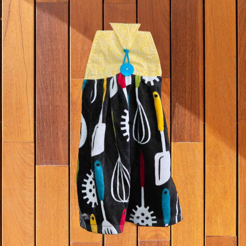 A kitchen towel that is designed to hand on your oven door