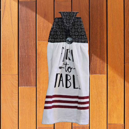 A kitchen towel that is designed to hand on your oven door