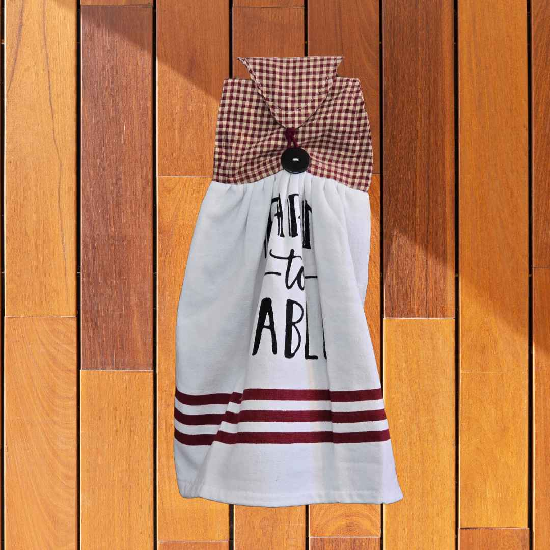 A kitchen towel that is designed to hand on your oven door