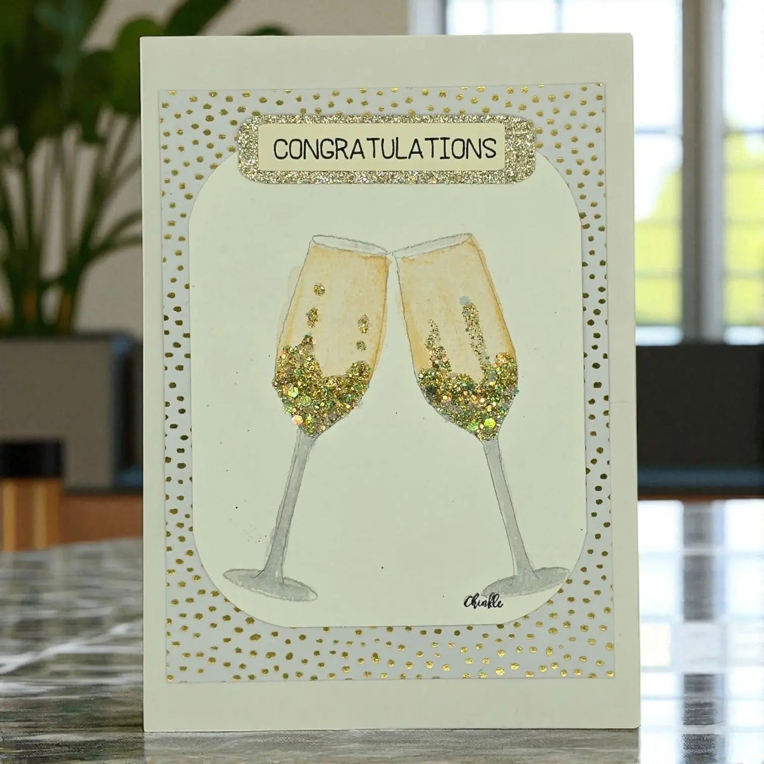 Elegant congratulations card with two champagne flutes of white wine, perfect for a wedding celebration.