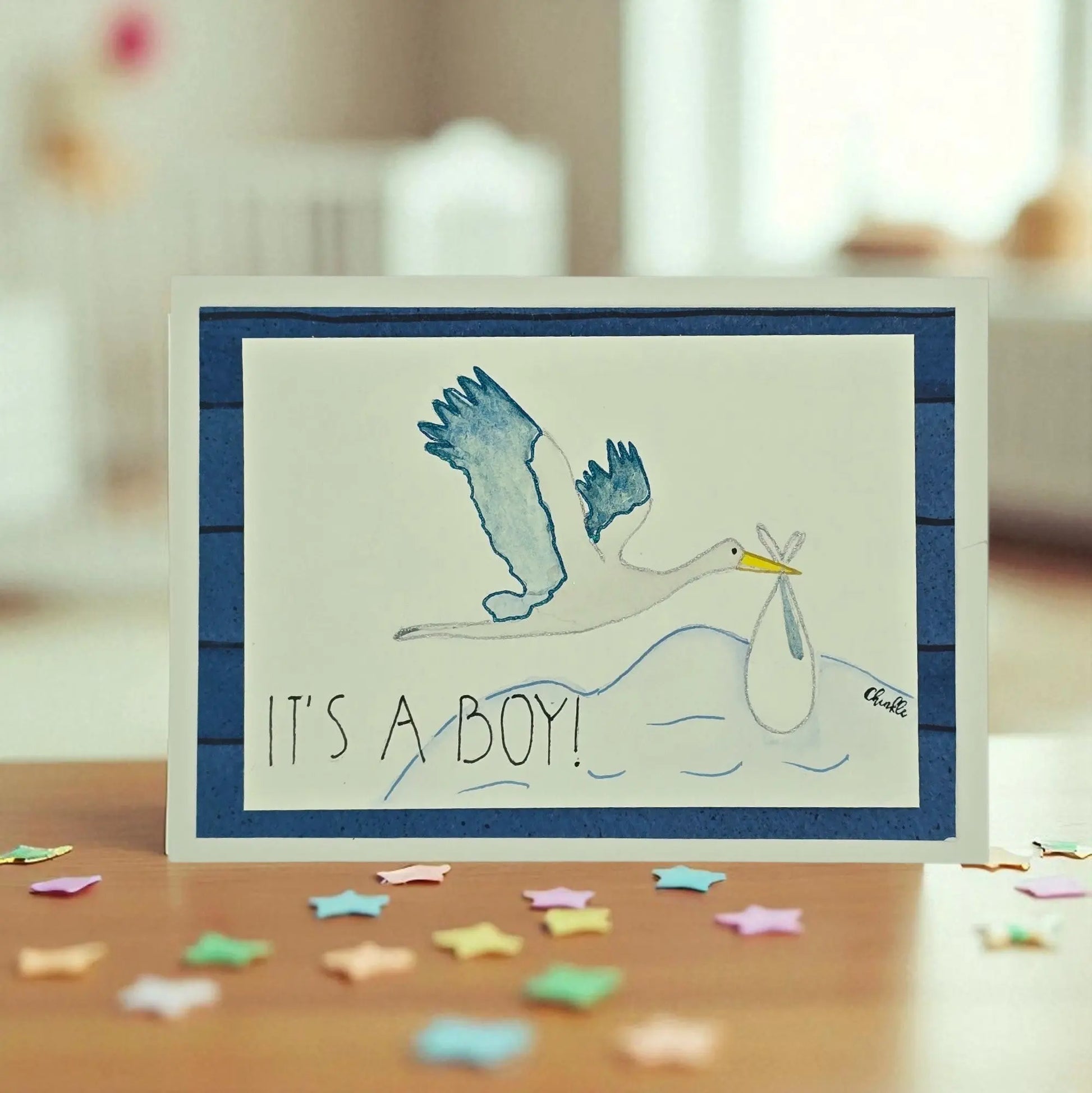 BABY BOY GREETING CARD WITH A BLUE STORK AND WORDS SAYING ITS A BOY