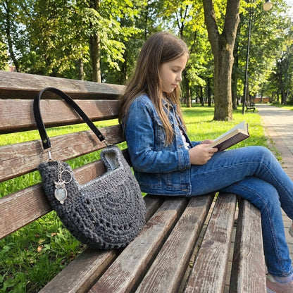 Boho Crochet Round Shell Style Black1 Bag  on park bench with model