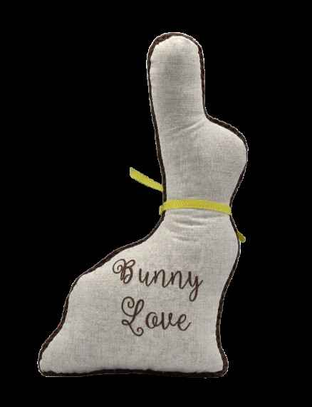 the back of crochet bunny is  solid linen with  the words Bunny Love Machine embroidered