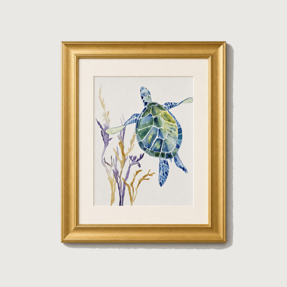 Framed watercolor art print of a sea turtle swimming among purple and gold seaweed, set in a gold frame with a white mat on a light gray background.