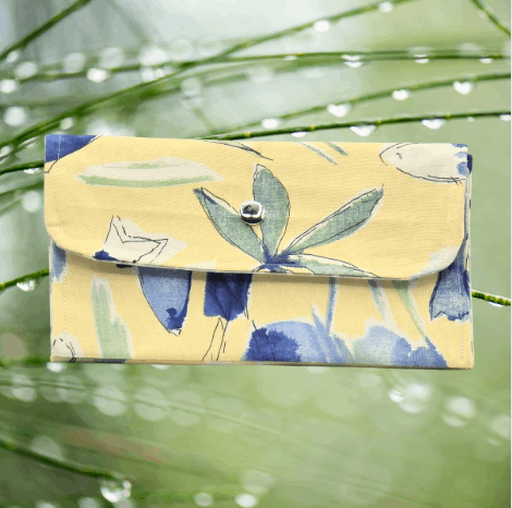 Soft wallet featuring, multiple inside pockets, and a snap closure for secure storage.