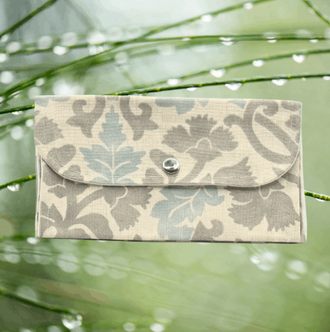 Soft wallet featuring, multiple inside pockets, and a snap closure for secure storage.
